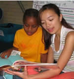 Teacher reading with a student
