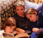 Mother reading to children